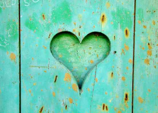 green wooden board with heart hole